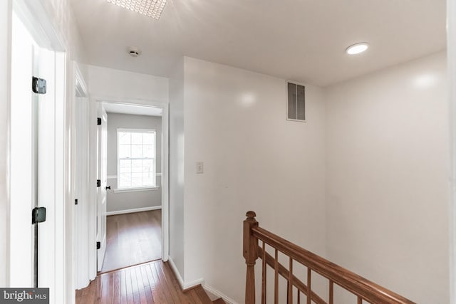 hallway with wood-type flooring