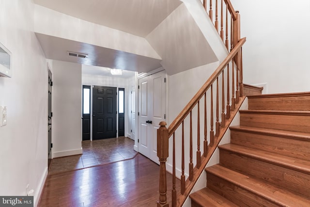 entrance foyer with dark hardwood / wood-style floors