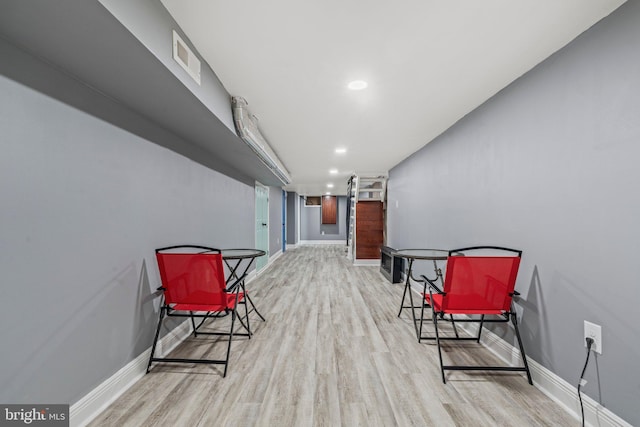 sitting room with light hardwood / wood-style flooring