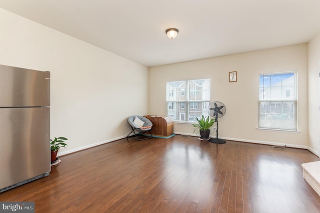 unfurnished room featuring dark hardwood / wood-style flooring