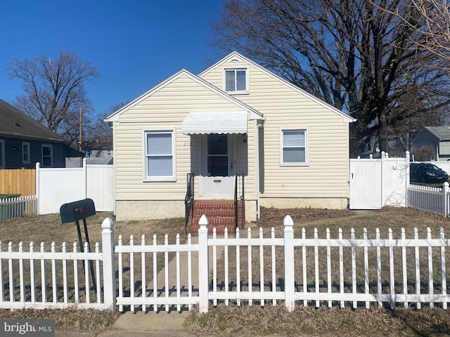 bungalow-style house with a fenced front yard