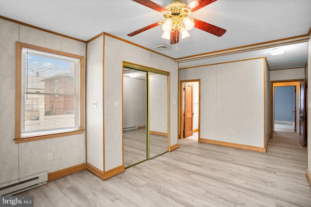 unfurnished bedroom with light wood-type flooring, visible vents, crown molding, and baseboard heating