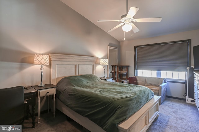 bedroom with dark carpet, vaulted ceiling, and ceiling fan