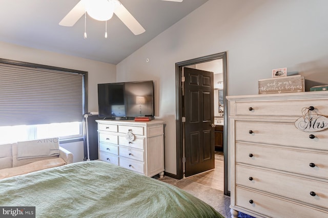 carpeted bedroom with vaulted ceiling and ceiling fan