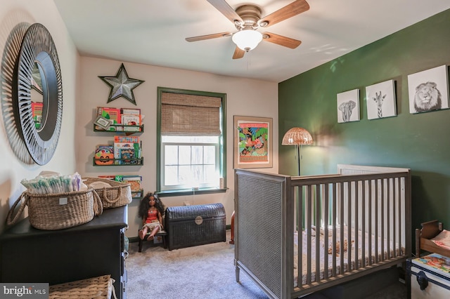 bedroom featuring light carpet and ceiling fan