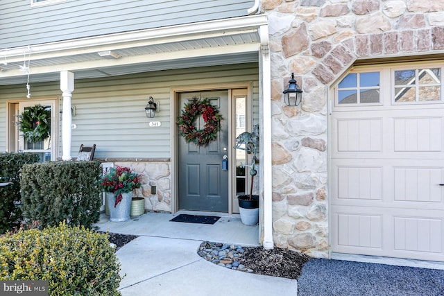 doorway to property featuring a garage