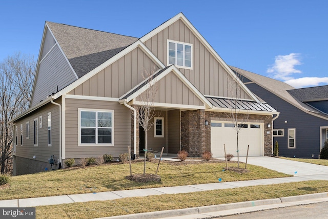 view of front of home with a garage and a front lawn