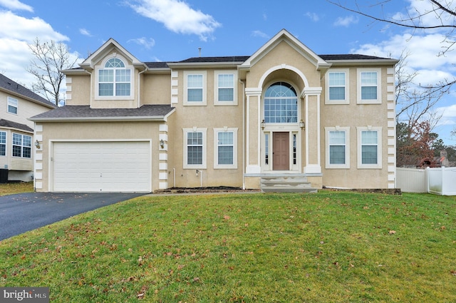 view of front of home featuring a garage and a front yard