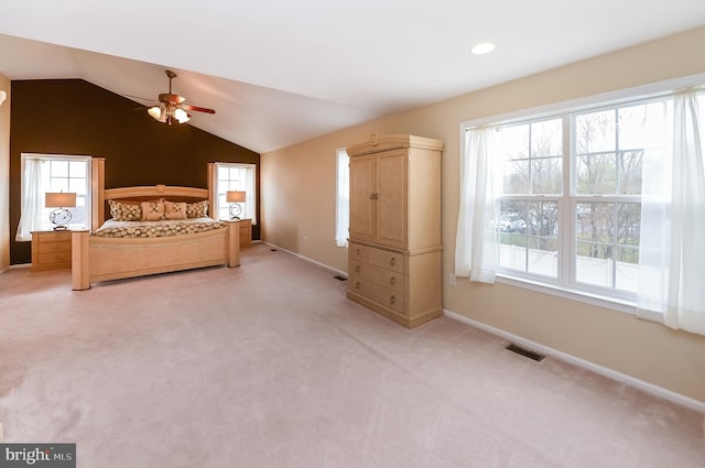 unfurnished bedroom with ceiling fan, carpet flooring, and vaulted ceiling