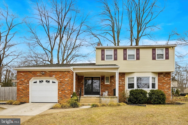 view of front of house featuring a garage, a porch, and a front yard