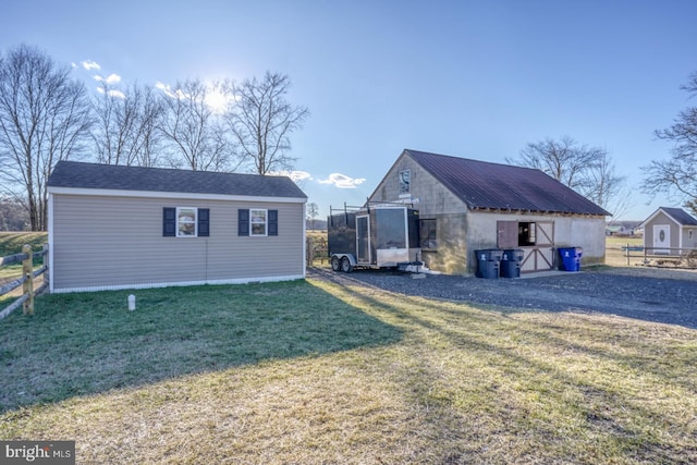 view of outbuilding with a yard