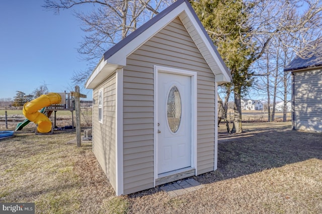 view of outbuilding with a playground