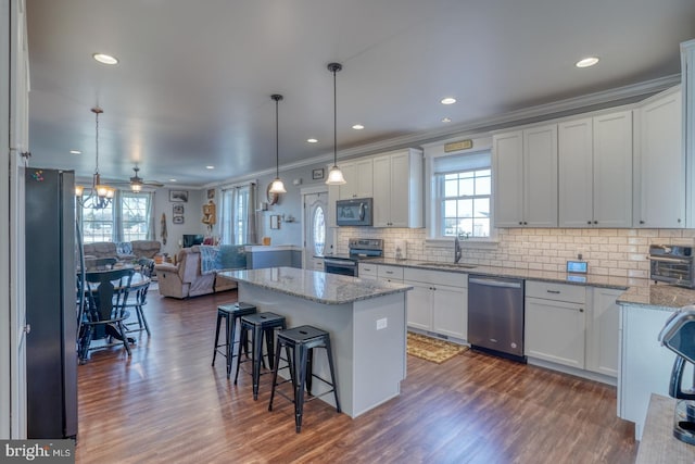 kitchen with sink, stainless steel appliances, and white cabinets