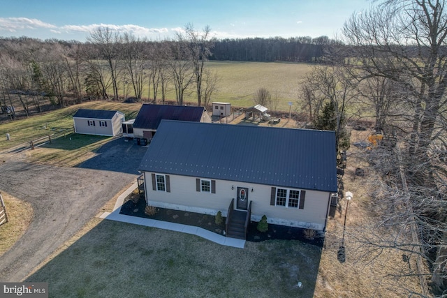 birds eye view of property with a rural view