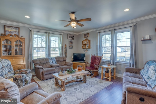 living room with crown molding, ceiling fan, and hardwood / wood-style floors