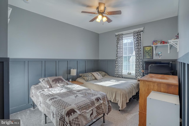 bedroom with light carpet and ceiling fan