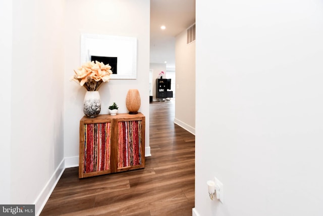 hall with dark hardwood / wood-style flooring