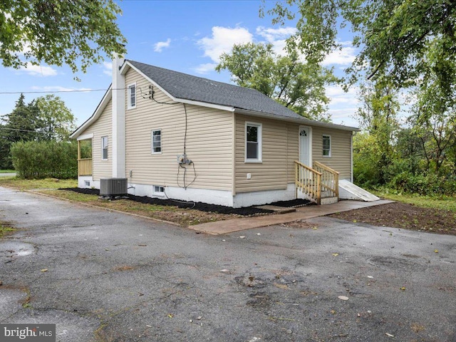 view of front of property featuring central air condition unit