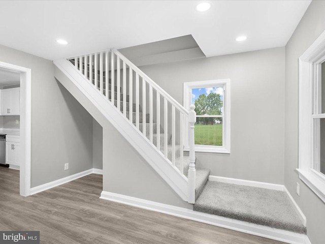 stairway with wood-type flooring