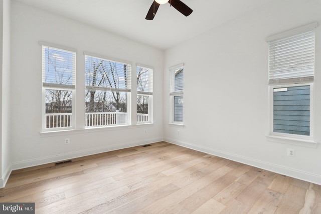 unfurnished room with ceiling fan and light hardwood / wood-style floors