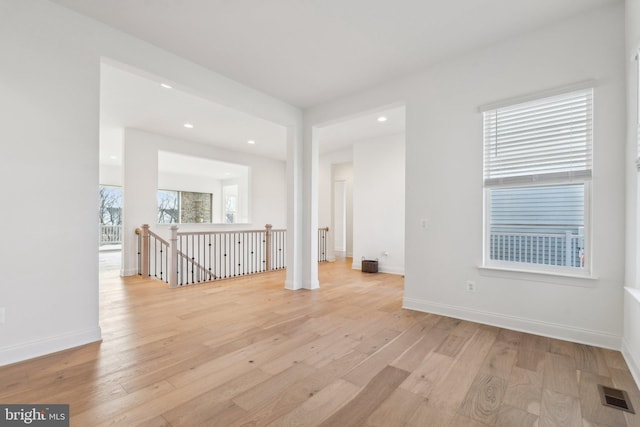 spare room featuring light hardwood / wood-style flooring