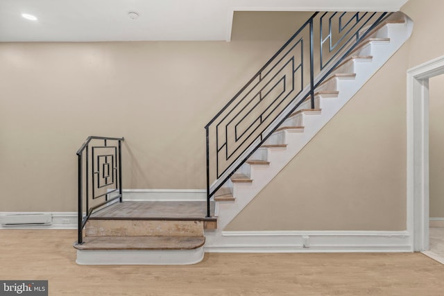 staircase featuring hardwood / wood-style flooring