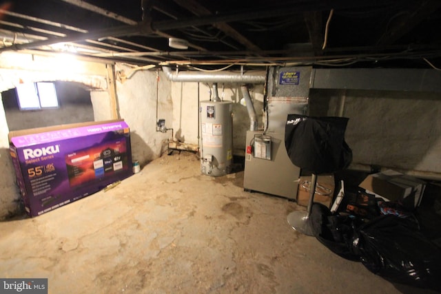 basement with gas water heater and heating unit