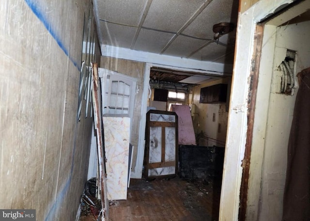 basement featuring a drop ceiling