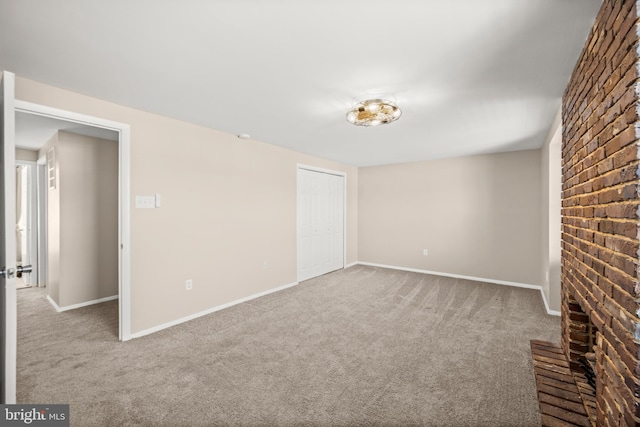 unfurnished living room featuring light carpet