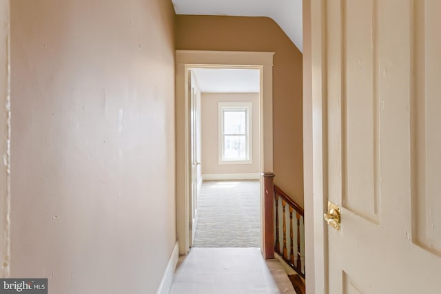 443 Manor St, Lancaster, PA 17603 - hall with vaulted ceiling, carpet flooring, an upstairs landing, and baseboards
