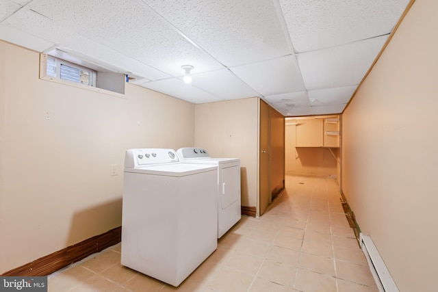 443 Manor St, Lancaster, PA 17603 - clothes washing area featuring baseboard heating, washing machine and clothes dryer, laundry area, and baseboards