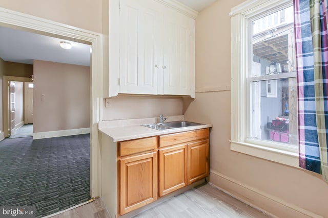 443 Manor St, Lancaster, PA 17603 - kitchen featuring light countertops, baseboards, and a sink