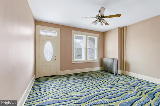 443 Manor St, Lancaster, PA 17603 - carpeted foyer with radiator heating unit, baseboards, and ceiling fan