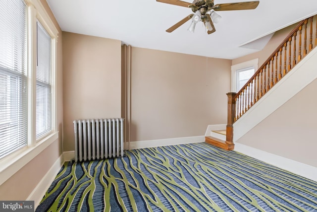 443 Manor St, Lancaster, PA 17603 - interior space featuring radiator heating unit, stairs, ceiling fan, carpet, and baseboards