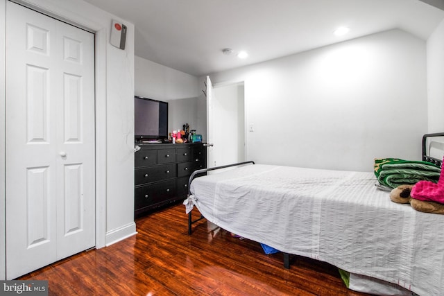 bedroom featuring dark hardwood / wood-style flooring