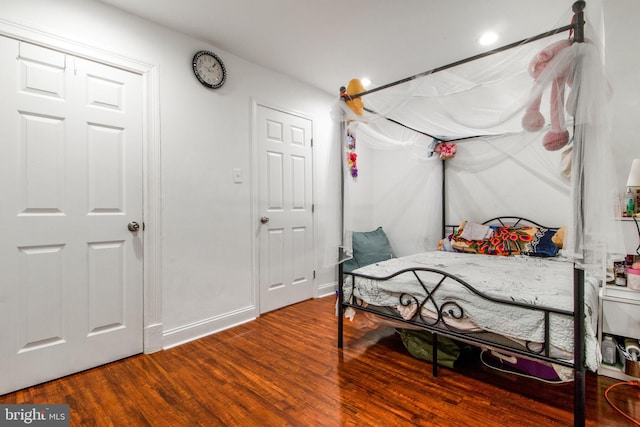 bedroom with hardwood / wood-style floors