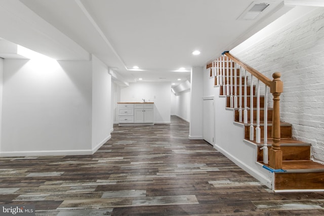 hallway featuring dark hardwood / wood-style floors