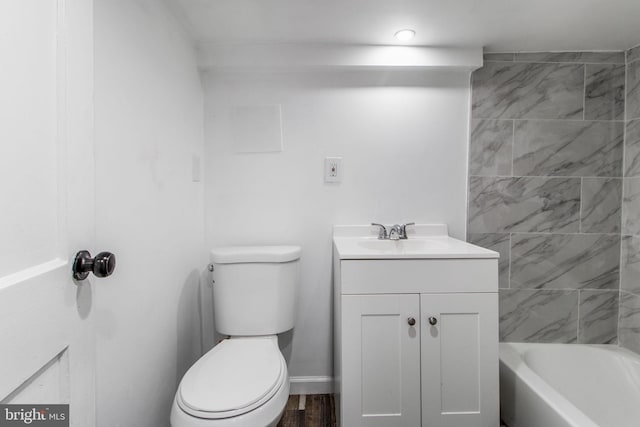 bathroom with vanity, wood-type flooring, and toilet