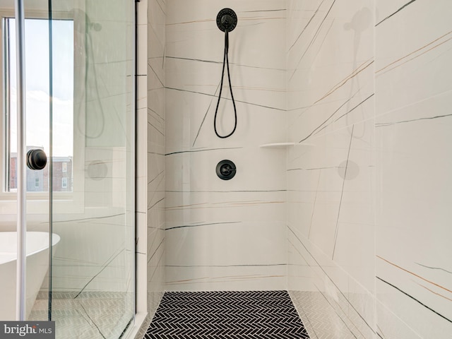 bathroom with a shower with shower door