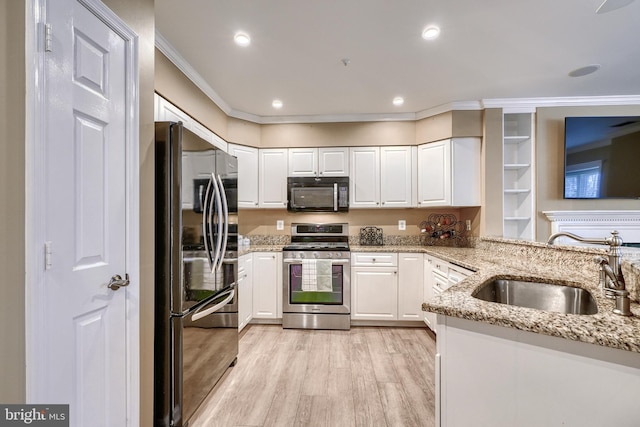 kitchen featuring sink, black appliances, and light stone countertops