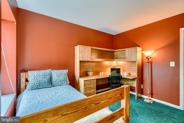 bedroom featuring dark carpet