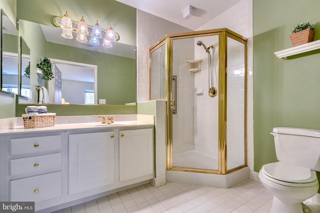 bathroom featuring vanity, tile patterned flooring, a shower with door, and toilet