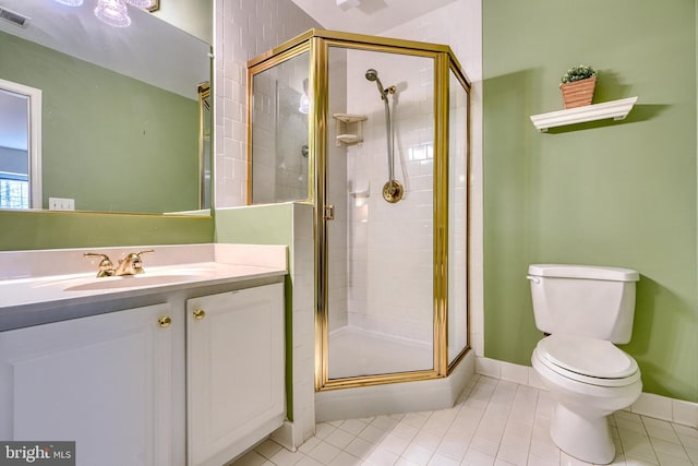 bathroom with vanity, toilet, tile patterned floors, and walk in shower