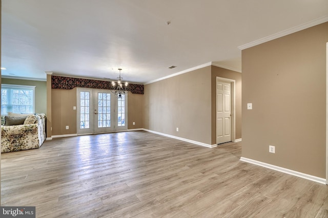 interior space featuring crown molding, a chandelier, and light wood-type flooring