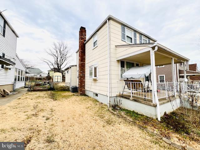 view of front of home with covered porch and central air condition unit