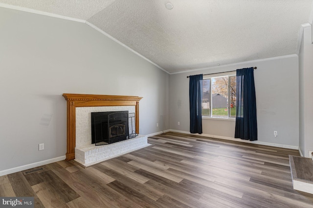 1762 Red Oak Ln, Waldorf, MD 20601 - unfurnished living room featuring a textured ceiling, ornamental molding, visible vents, wood finished floors, and lofted ceiling