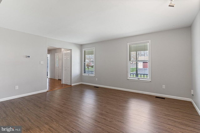 1762 Red Oak Ln, Waldorf, MD 20601 - unfurnished room featuring dark wood-style floors, baseboards, and visible vents