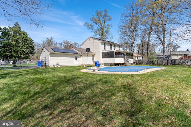 1762 Red Oak Ln, Waldorf, MD 20601 - back of property with a yard, a fenced backyard, a sunroom, and a chimney