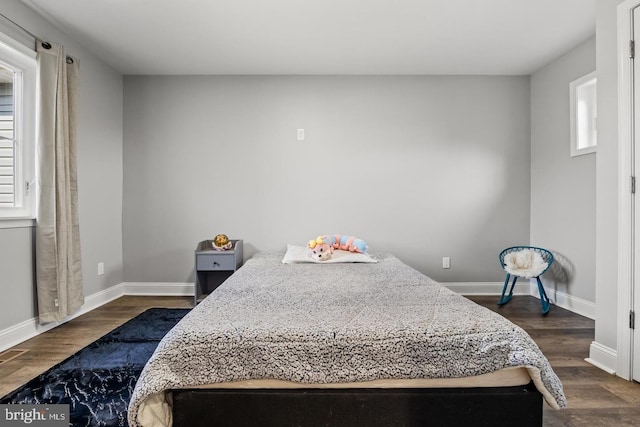 bedroom featuring dark wood-type flooring