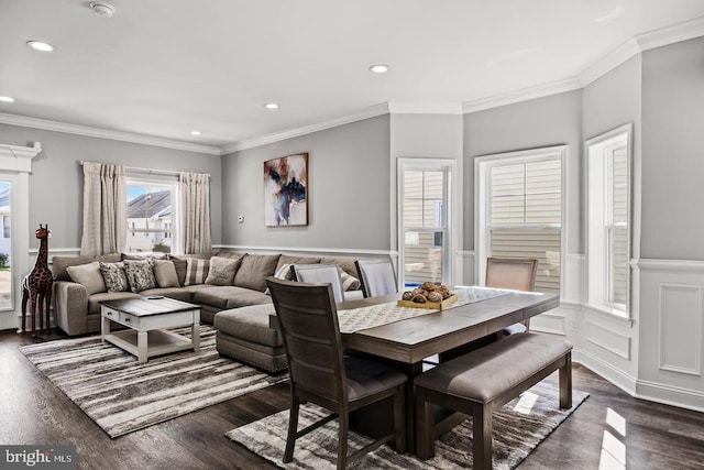 dining room with crown molding and dark hardwood / wood-style flooring